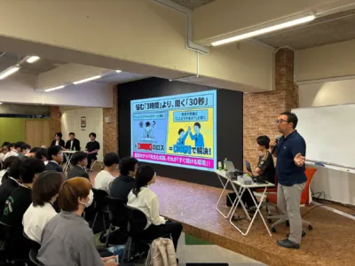 講義で説明する西山泰弘氏